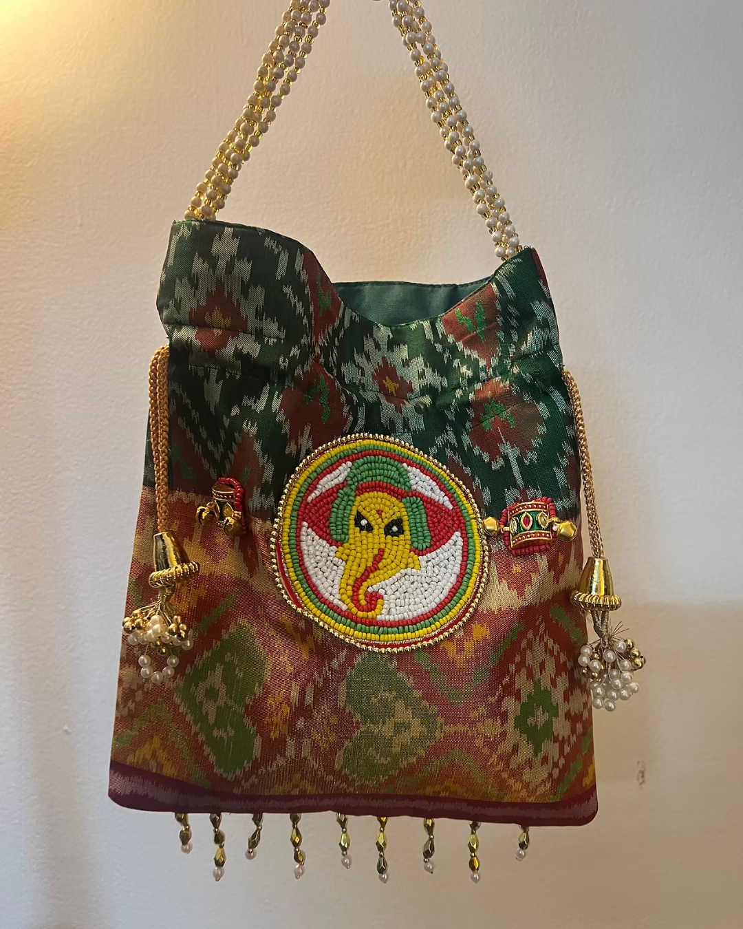 White and Beige Neutral Clean Women Bags Instagram Post (52) God Motif Potli Bag - Image 1
